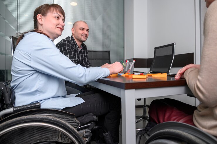 Confident Businesswoman Wheelchair Desk 23 2148497258 — EnableBiz Consultancy